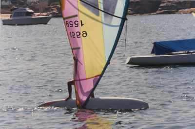 Rig upside down, board stern-first railride windsurfing freestyle